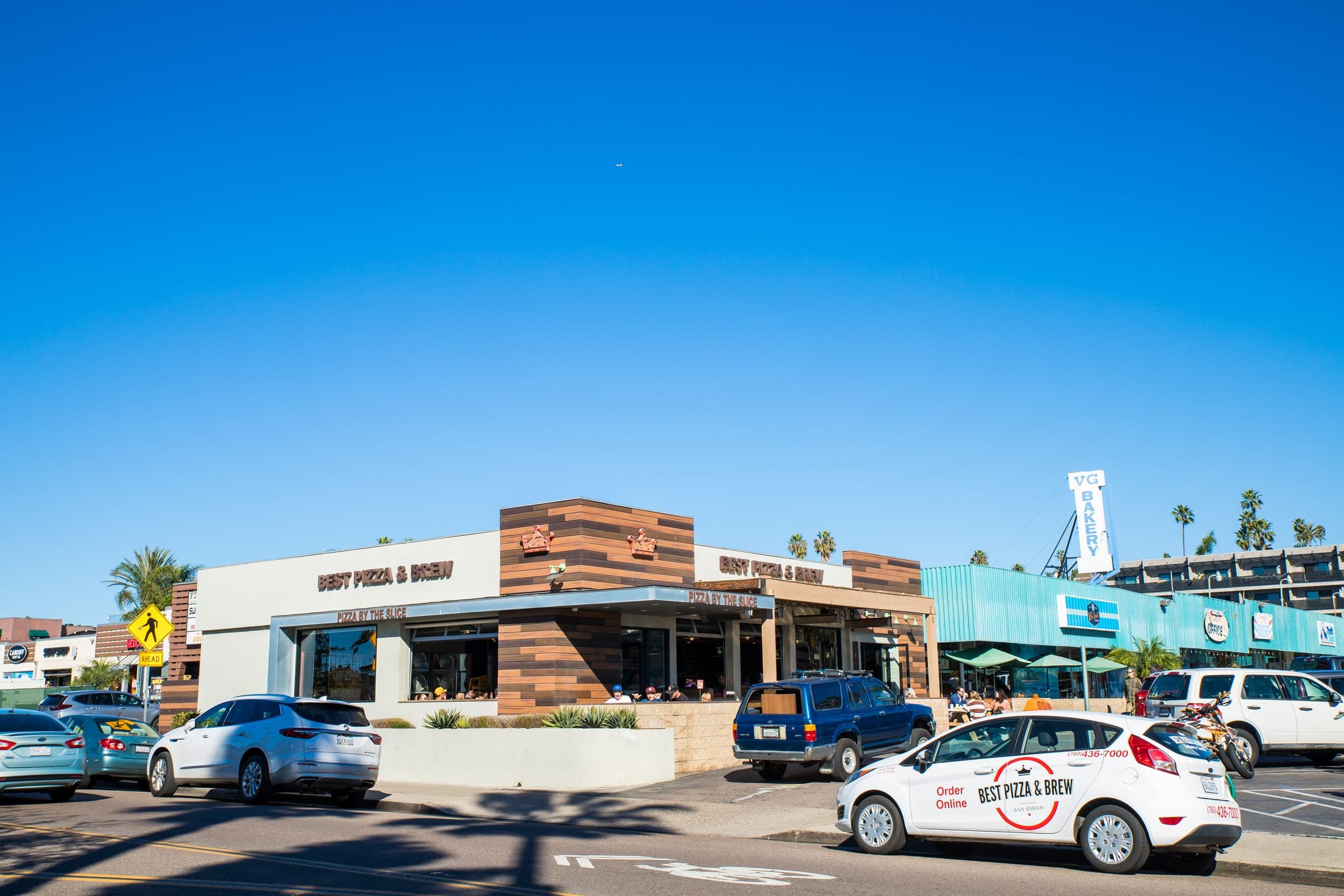 Street view of Best Pizza & Brew Cardiff with patio seating along the front