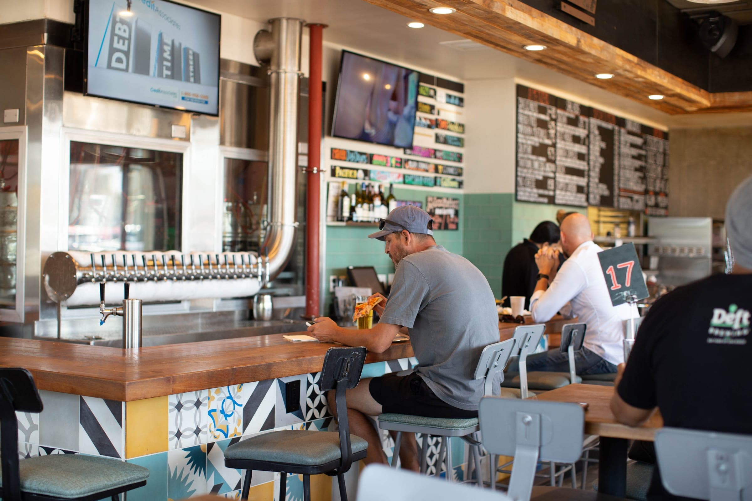 The bar and tap wall inside Best Pizza & Brew Cardiff