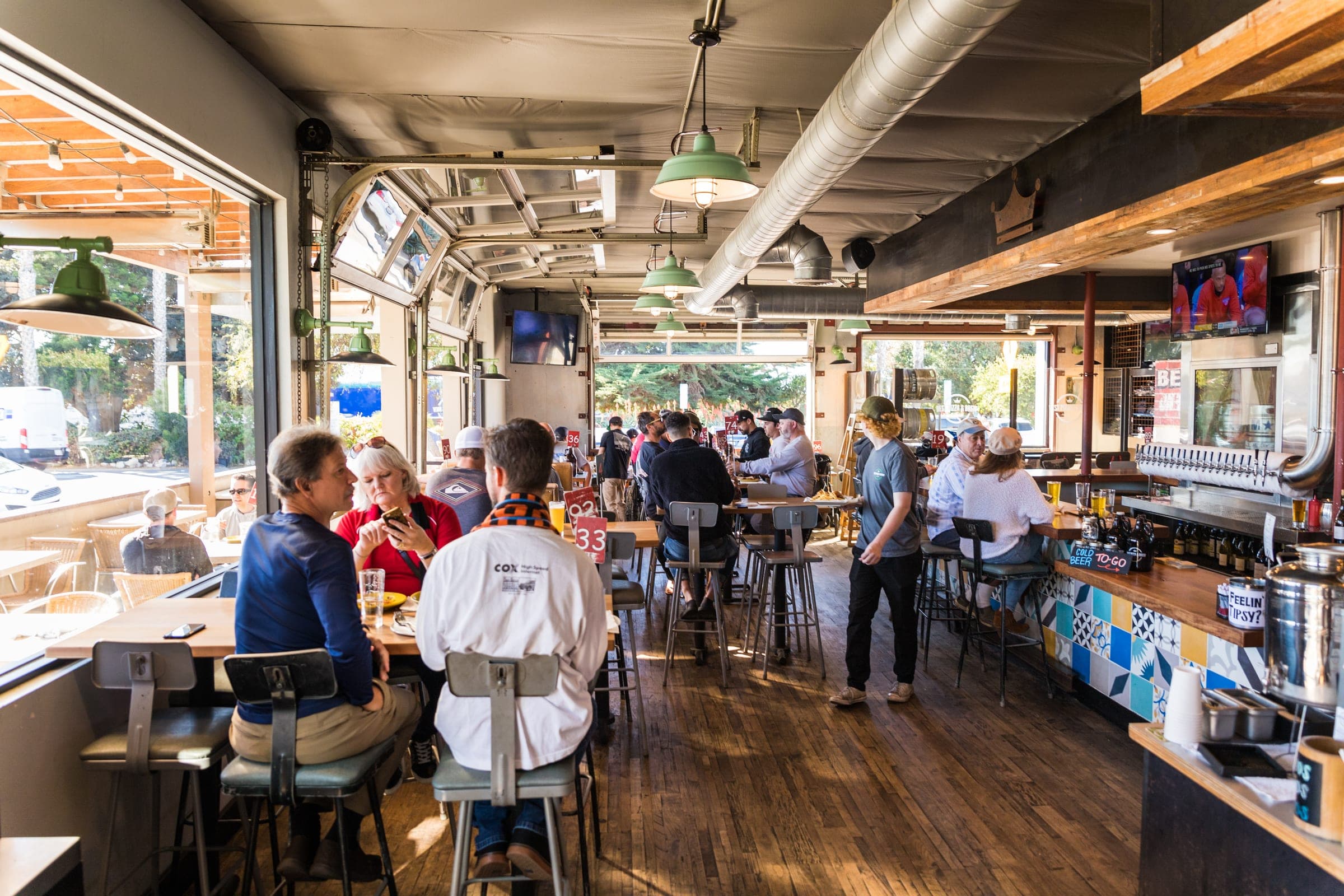 Tables set for guests inside the Cardiff taproom