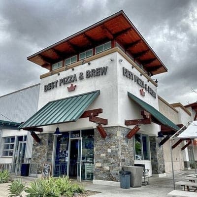 The Best Pizza & Brew Carmel Mountain building with green awnings and rooftop signage
