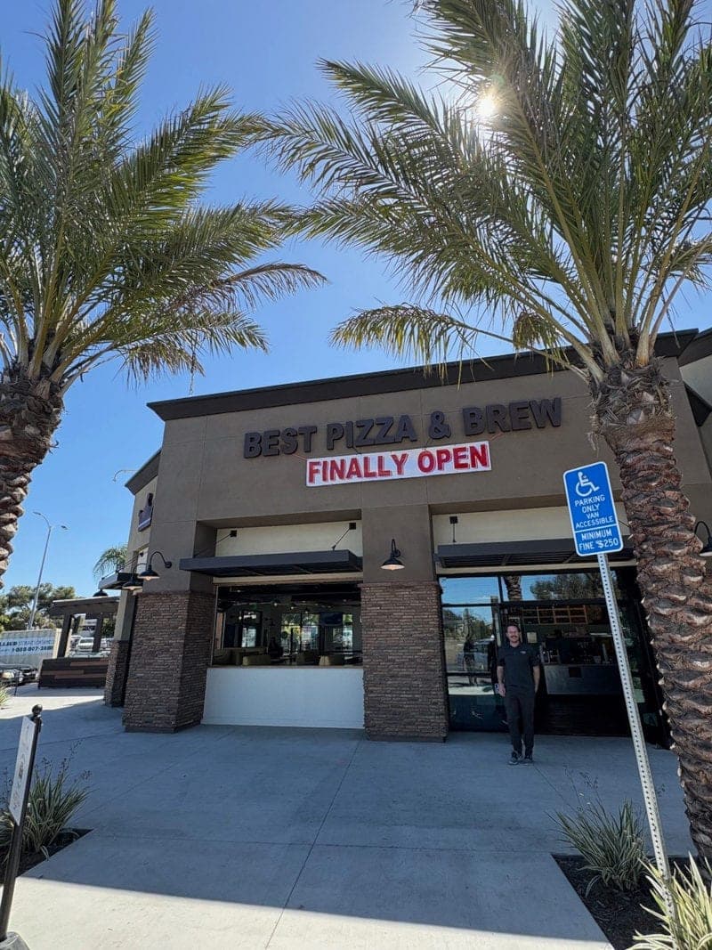 The Best Pizza & Brew Clairemont storefront on Genesee Avenue, framed by palm trees