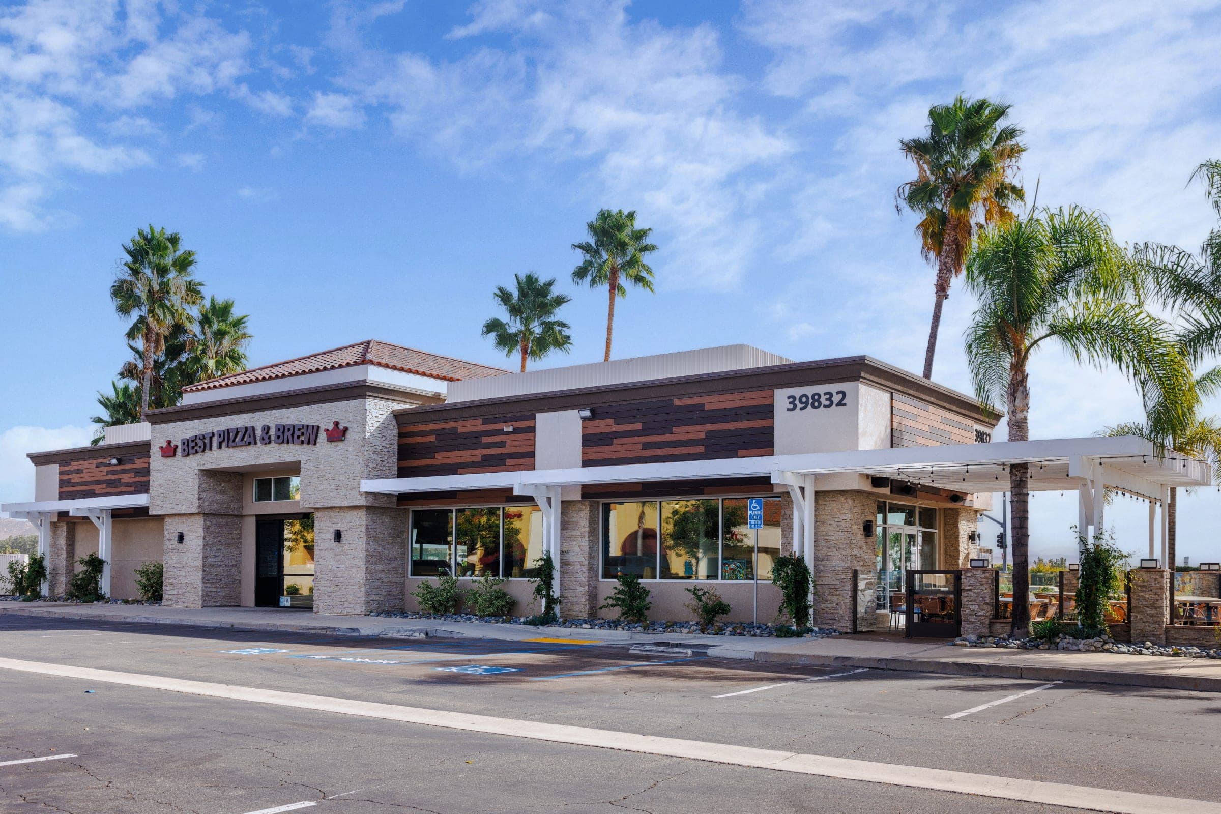 The Best Pizza & Brew Murrieta building at 39832 Los Alamos Road, with palm trees along the front and rooftop signage