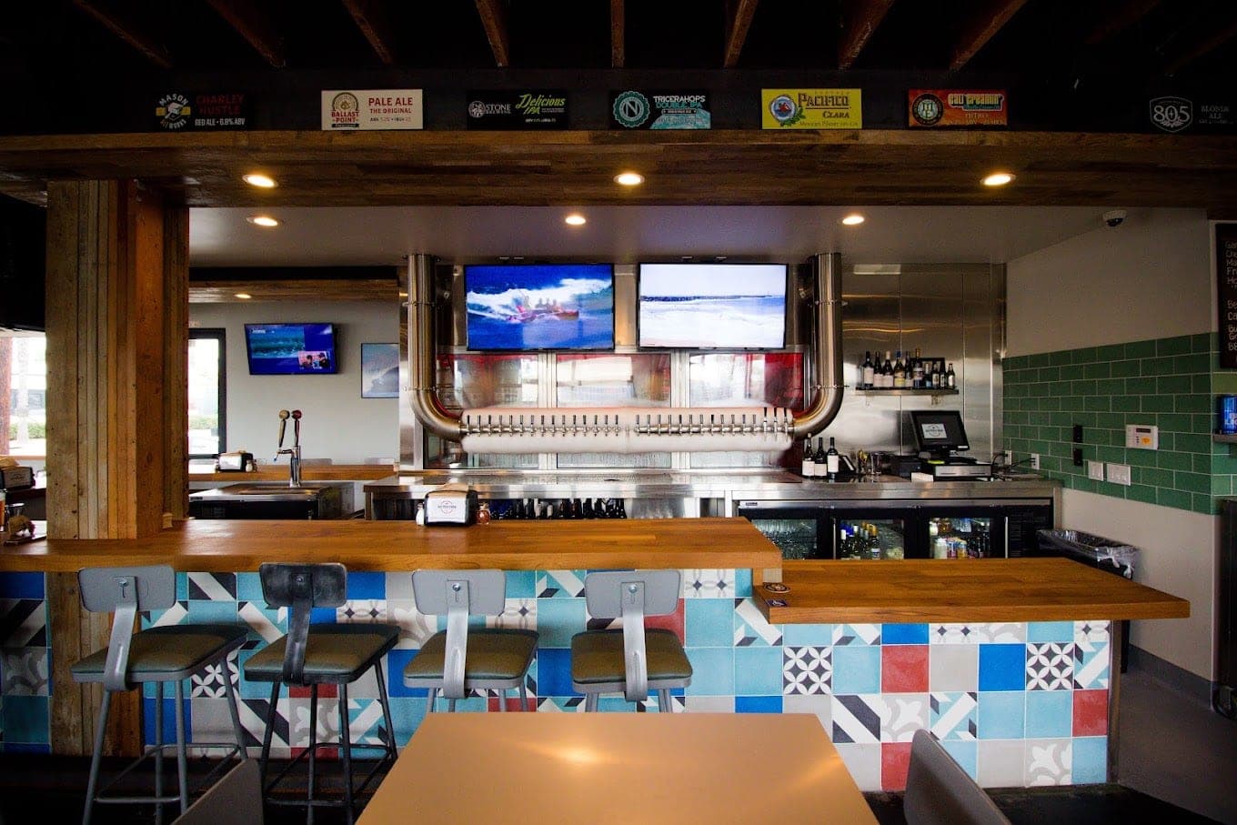 Tables and booth seating inside Best Pizza & Brew Oceanside