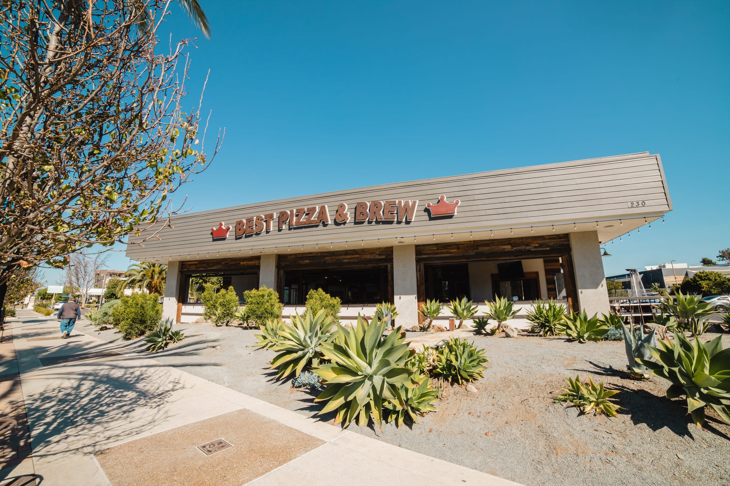 The Best Pizza & Brew Vista building on South Santa Fe Avenue, with agave planting along the frontage