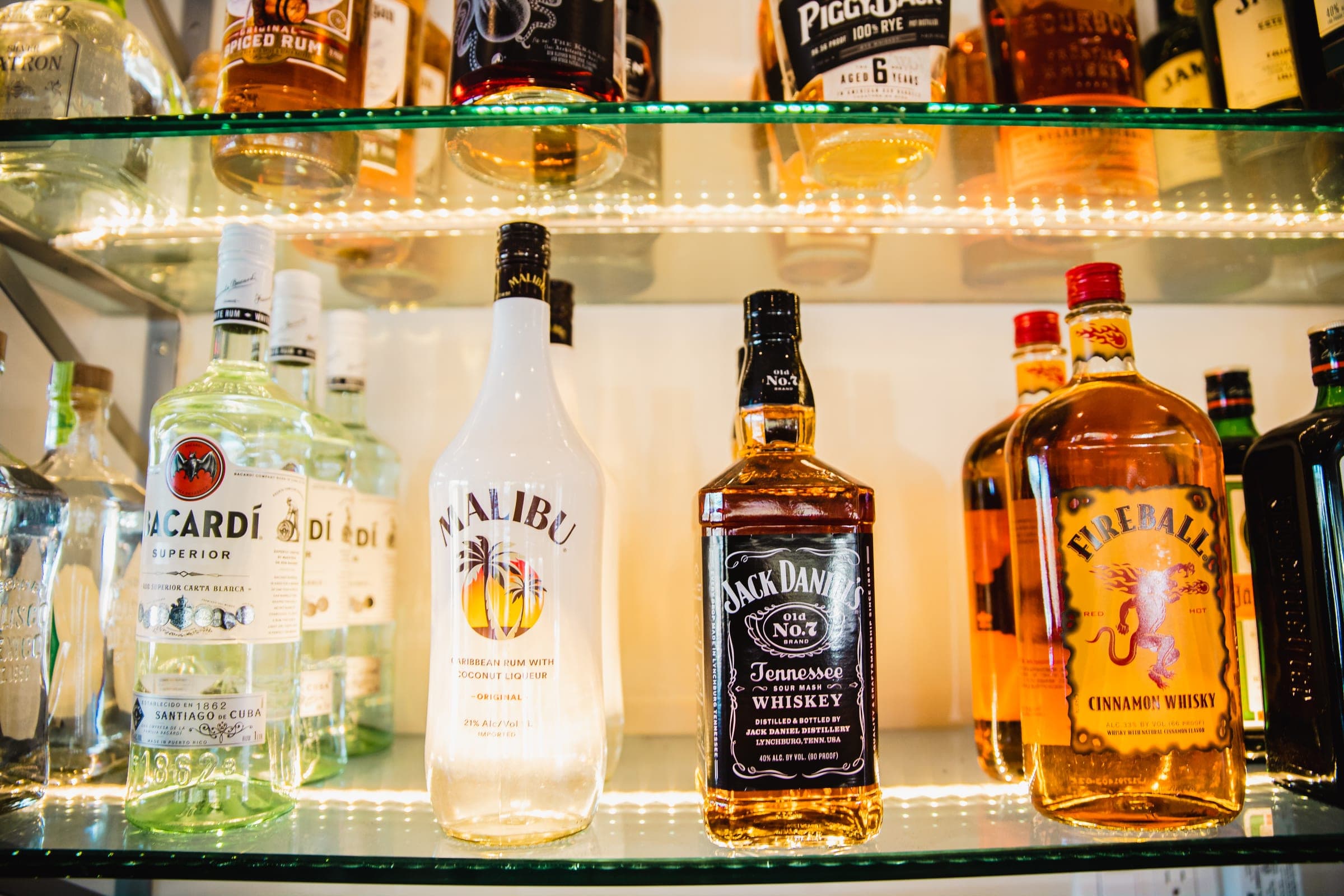 The full bar at Best Pizza & Brew Vista, with backlit spirits on the shelves